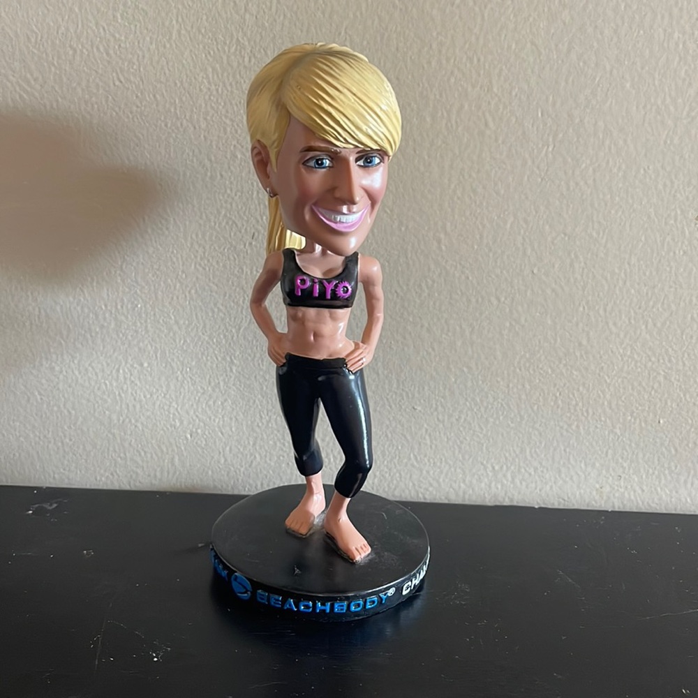 Beachbody Blonde Bobblehead with Black and Purple Accents